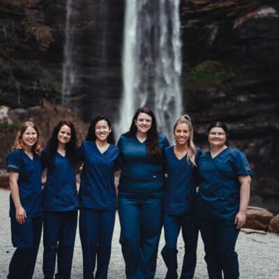 Toccoa Falls College nursing students pose in front of Toccoa Falls